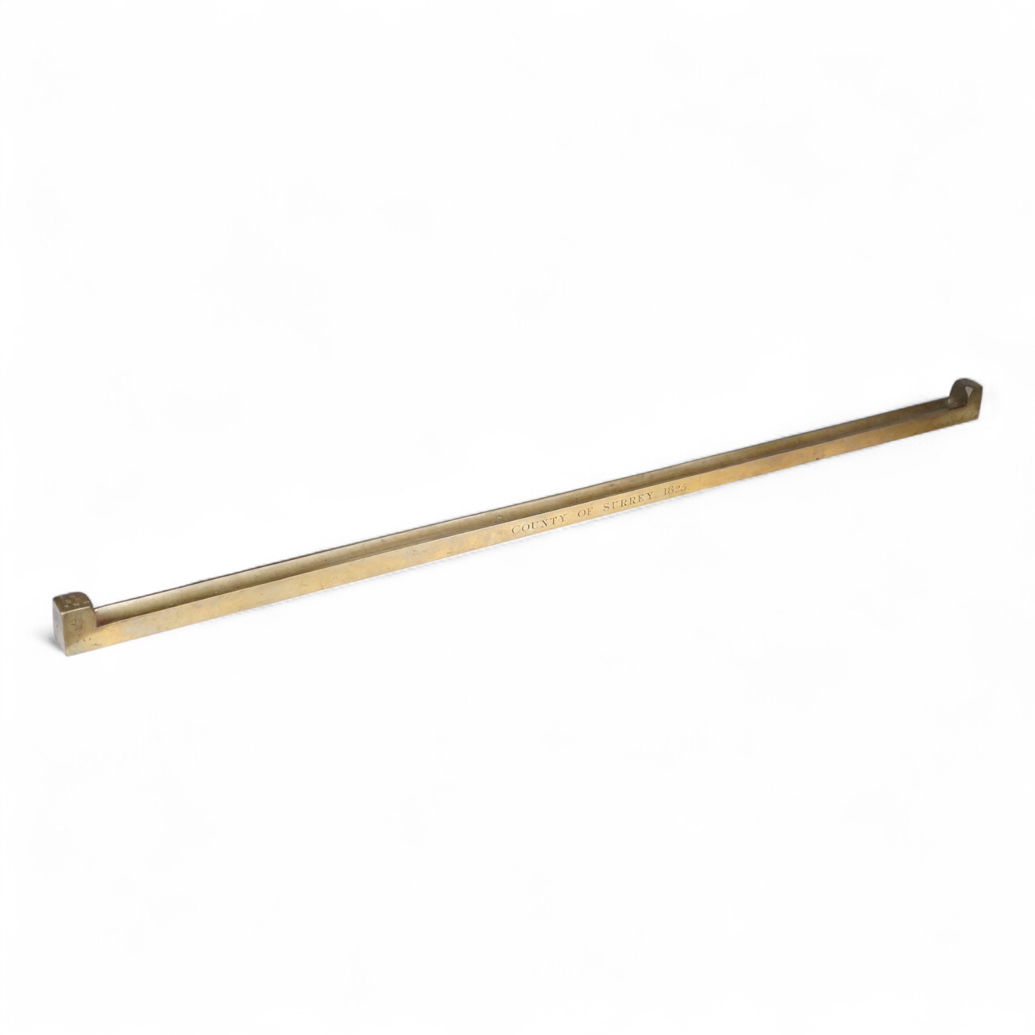 A George IV Imperial brass yard stick, engraved with County of Surrey 1825, with official stamps and crowned VR, etc.